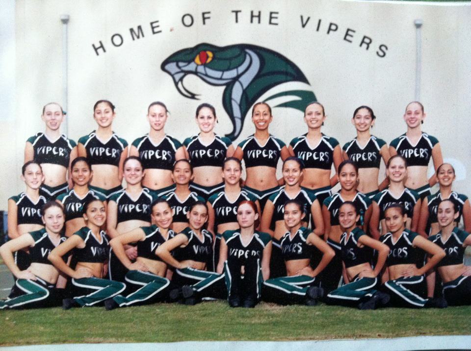 Varela cheerleading squad in front of the Home of the Vipers mural