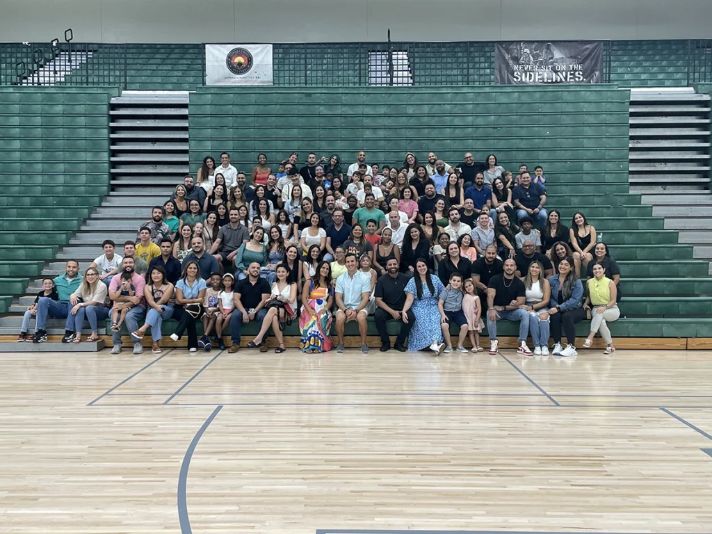 Alumni gathered on the bleachers